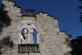 Santa Maria Maggiore - Museo dello spazzacamino - bifora con dietro campanile chiesa di Santa Maria Maggiore.jpg